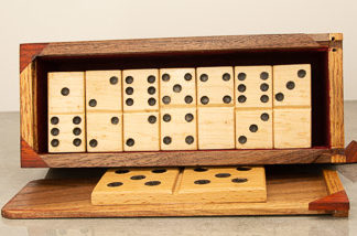 Hand crafted Wood Domino Set. The set includes the standard double 0 up to the double 6. This set includes a custom wooden box with sliding lid to store the dominoes.