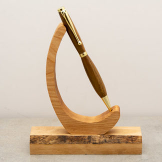 This Funline ball point pen has a custom wood turned barrel with metal hardware. The finish on the wood shows the natural wood grain and color. This light weight pen is ideal for every day use and uses a standard Cross Style refill when you run low on ink.