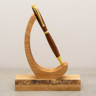 This Funline ball point pen has a custom wood turned barrel with metal hardware. The finish on the wood shows the natural wood grain and color. This light weight pen is ideal for every day use and uses a standard Cross Style refill when you run low on ink.