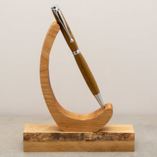 This Funline ball point pen has a custom wood turned barrel with metal hardware. The finish on the wood shows the natural wood grain and color. This light weight pen is ideal for every day use and uses a standard Cross Style refill when you run low on ink.
